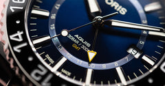 ORIS 01 798 7754 4135-07 8 24 05PEB Aquis GMT Date miesten automaattikello